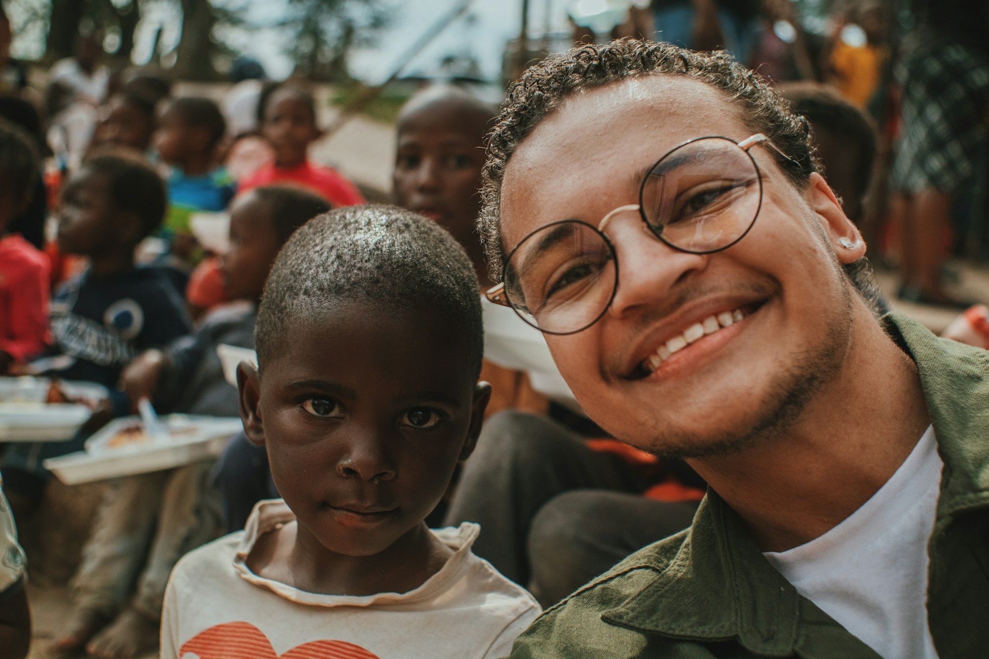A man and a boy smiling