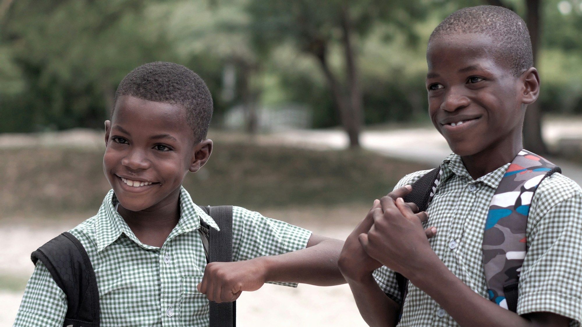 Two smiling boys in uniform