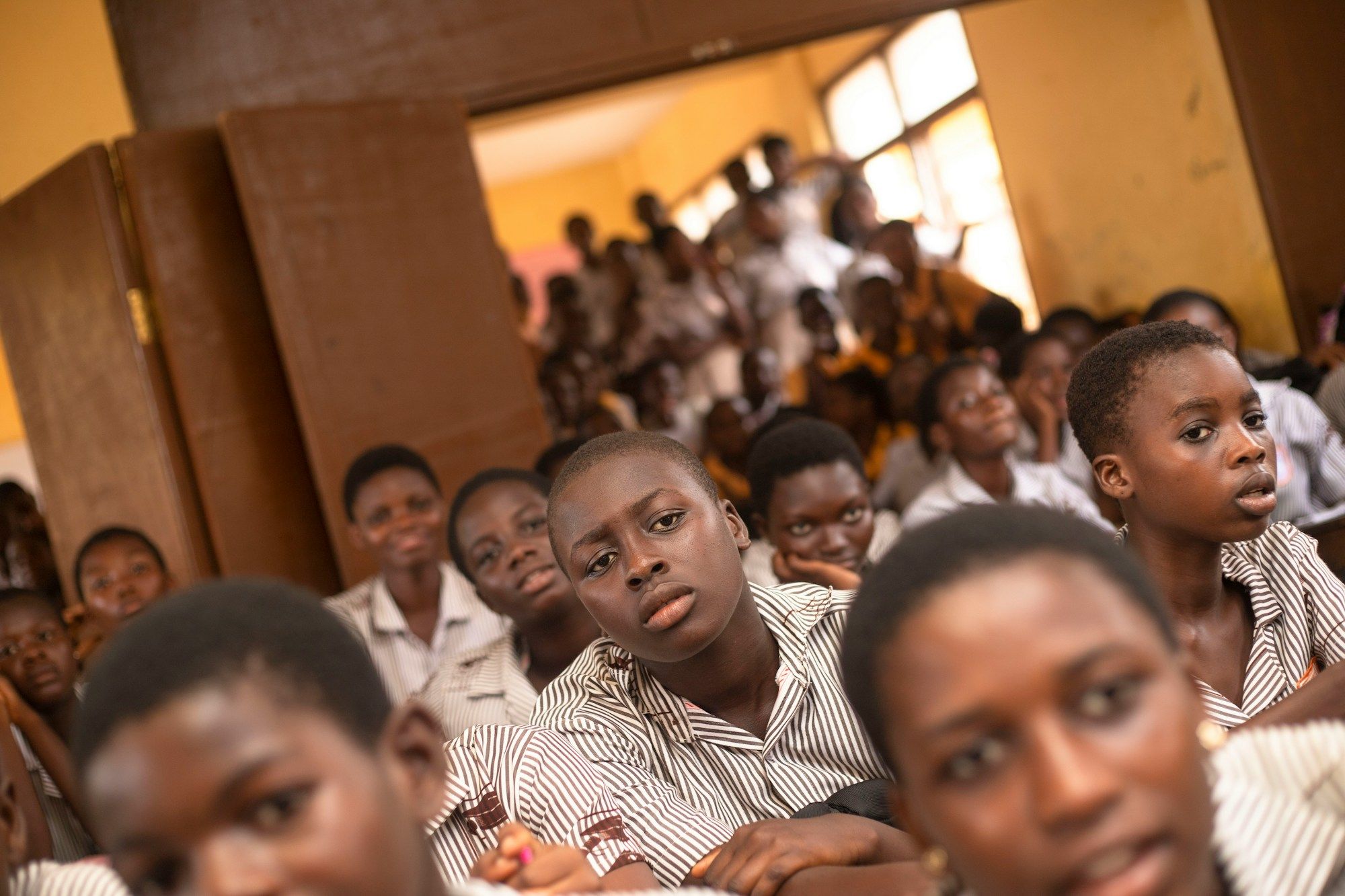 Young people sitting next to each other